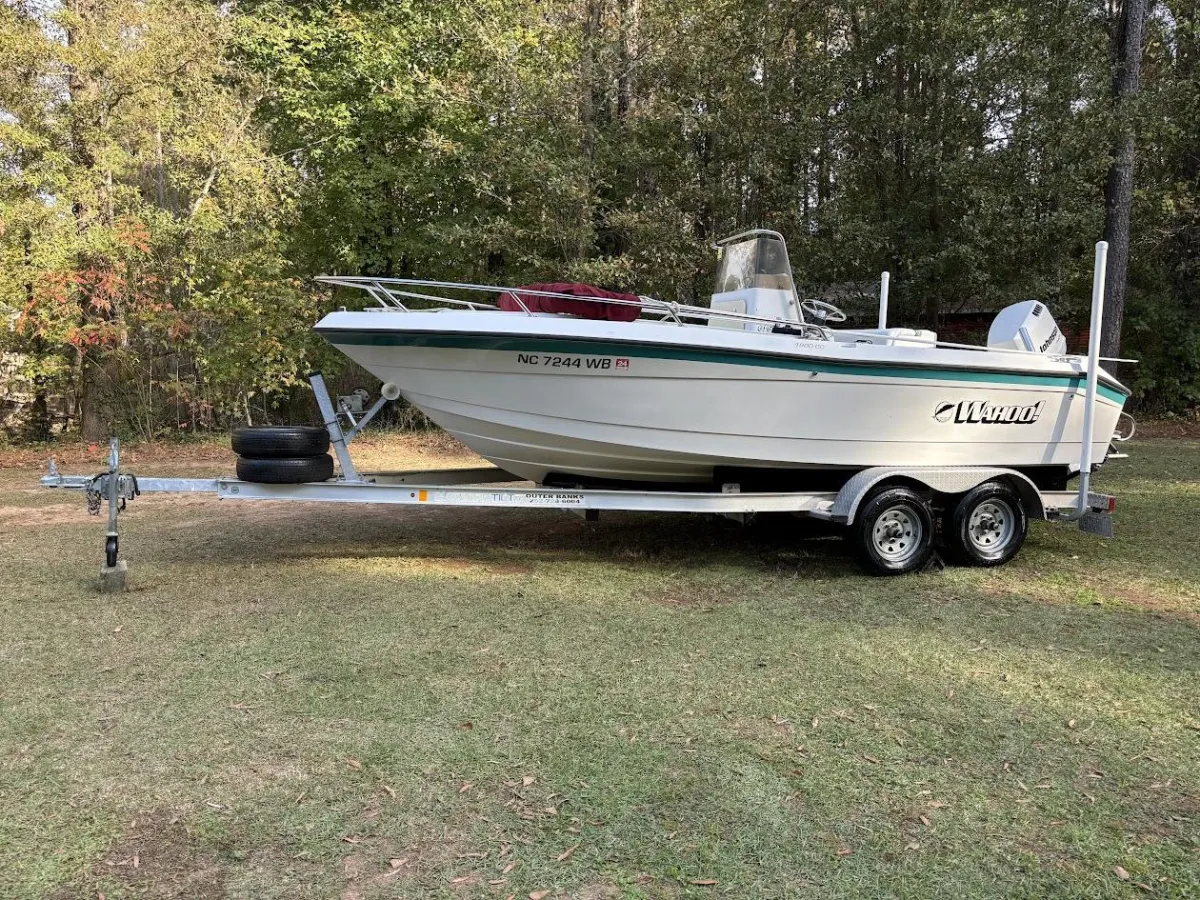 Green boat detailed by Tyree's Auto Detailing.